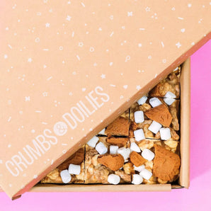 Crumbs & Doilies Biscoff Rocky Road with marshmallows, Biscoff chunks, and white chocolate in branded box.